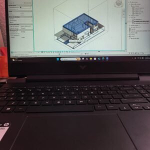 Laptop mostrando un modelo arquitectónico 3D isométrico en Autodesk Revit.